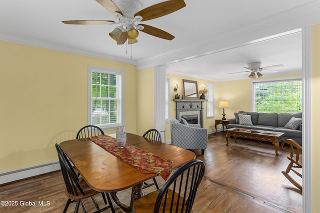 4333 County Route 48, Argyle, NY 12809 - dining area featuring ceiling fan, wood finished floors, a fireplace, ornamental molding, and baseboards