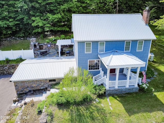 4333 County Route 48, Argyle, NY 12809 - rear view of house with metal roof, a chimney, covered porch, and a deck