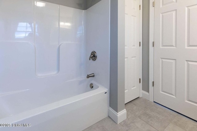 30 W St, Hudson Falls, NY 12839 - full bath with washtub / shower combination, tile patterned flooring, and baseboards