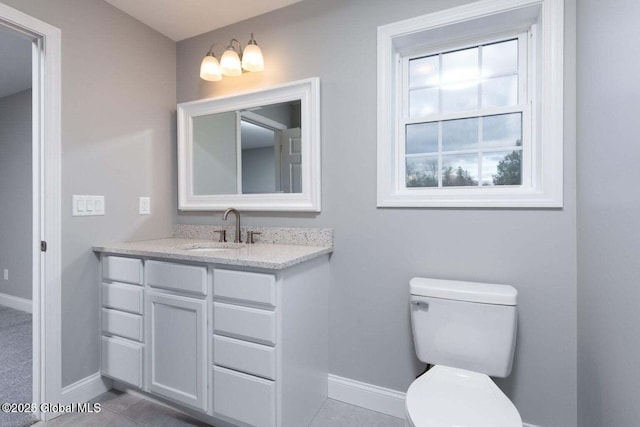 30 W St, Hudson Falls, NY 12839 - bathroom with baseboards, vanity, and toilet