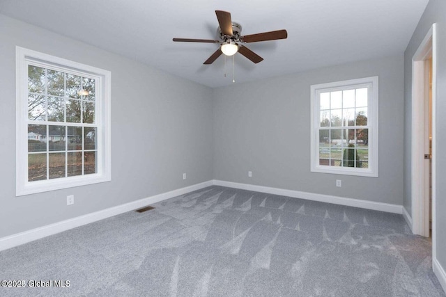 30 W St, Hudson Falls, NY 12839 - empty room with plenty of natural light, dark carpet, baseboards, and a ceiling fan