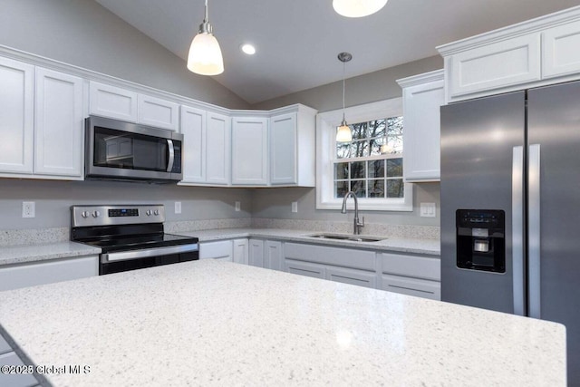 30 W St, Hudson Falls, NY 12839 - kitchen with appliances with stainless steel finishes, a sink, light countertops, lofted ceiling, and hanging light fixtures