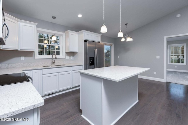 30 W St, Hudson Falls, NY 12839 - kitchen with stainless steel refrigerator with ice dispenser, a sink, dark wood-type flooring, lofted ceiling, and white cabinets