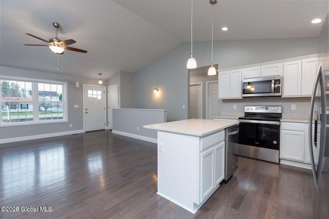 30 W St, Hudson Falls, NY 12839 - kitchen with appliances with stainless steel finishes, vaulted ceiling, open floor plan, a kitchen island, and ceiling fan