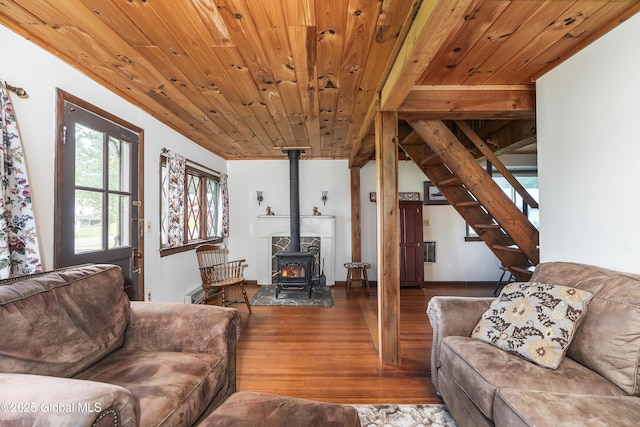 5882 Lake Rd, Galway, NY 12074 - living room with hardwood / wood-style floors, a wood stove, stairs, and wooden ceiling