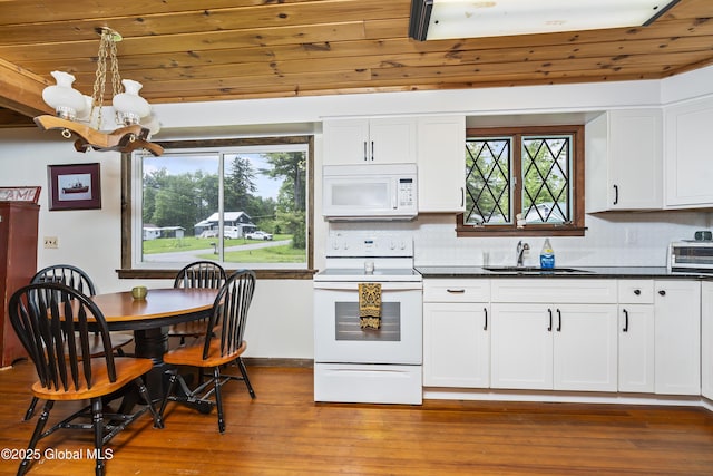5882 Lake Rd, Galway, NY 12074 - kitchen with white appliances, a sink, a chandelier, wood finished floors, and dark countertops