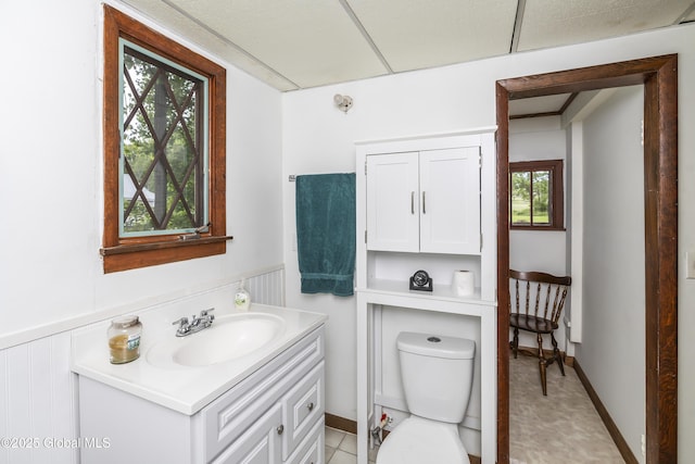 5882 Lake Rd, Galway, NY 12074 - bathroom with vanity, toilet, and a wainscoted wall
