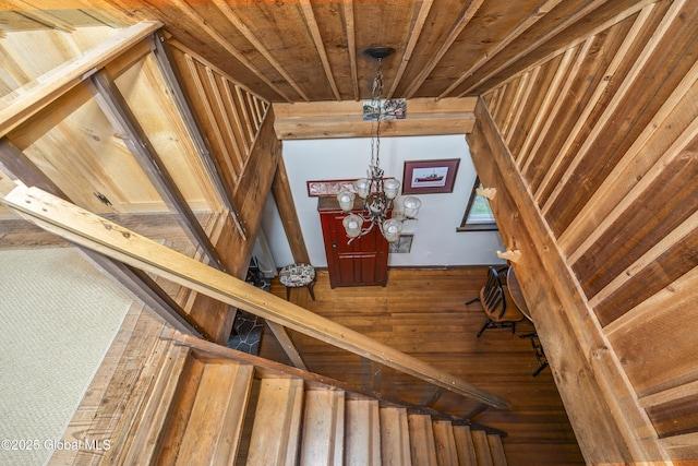 5882 Lake Rd, Galway, NY 12074 - stairs featuring wood walls, a chandelier, and wooden ceiling