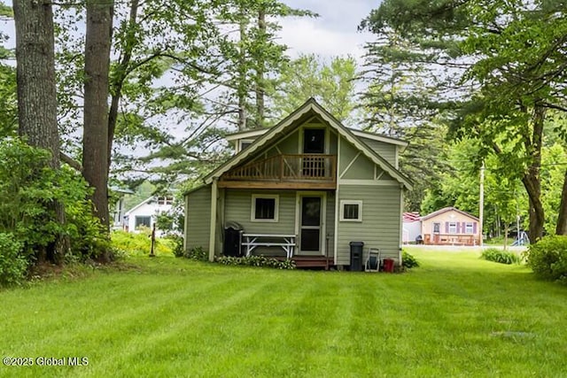 5882 Lake Rd, Galway, NY 12074 - rear view of property with a yard and a balcony