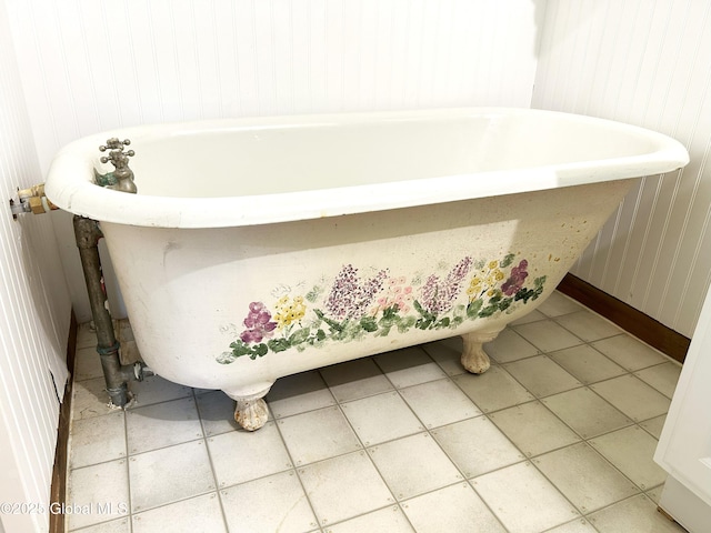 5882 Lake Rd, Galway, NY 12074 - bathroom with a freestanding tub, tile patterned flooring, and wood walls