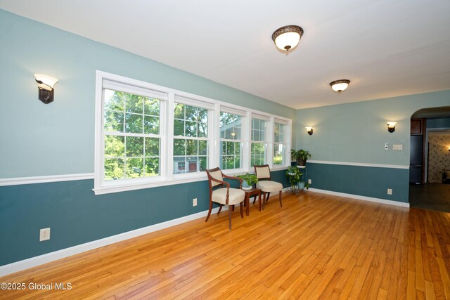 9 S Maple Ln, Colonie, NY 12211 - living area with hardwood / wood-style floors, baseboards, and arched walkways