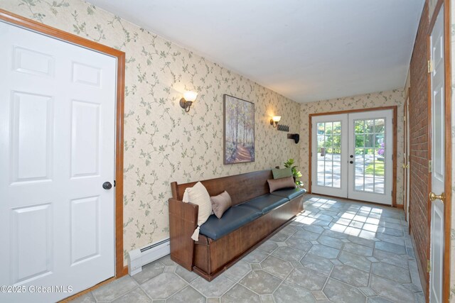 9 S Maple Ln, Colonie, NY 12211 - living area with french doors, a baseboard heating unit, wallpapered walls, and light tile patterned flooring