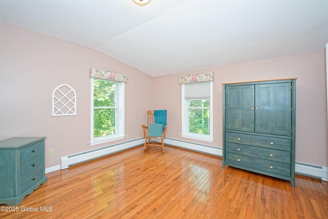 9 S Maple Ln, Colonie, NY 12211 - unfurnished room with vaulted ceiling, light wood-style flooring, a baseboard heating unit, and baseboards