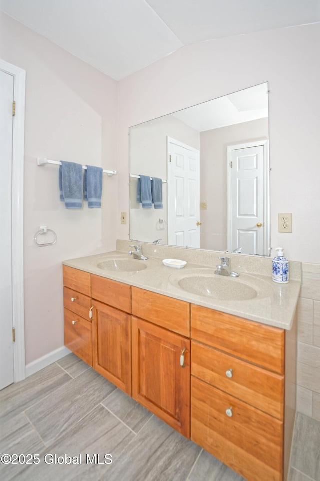 9 S Maple Ln, Colonie, NY 12211 - full bathroom featuring double vanity and baseboards