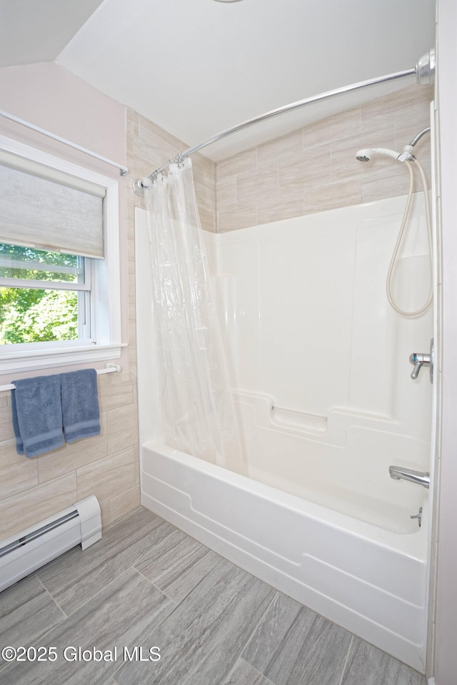 9 S Maple Ln, Colonie, NY 12211 - bathroom with shower / tub combo, baseboard heating, and wood finished floors