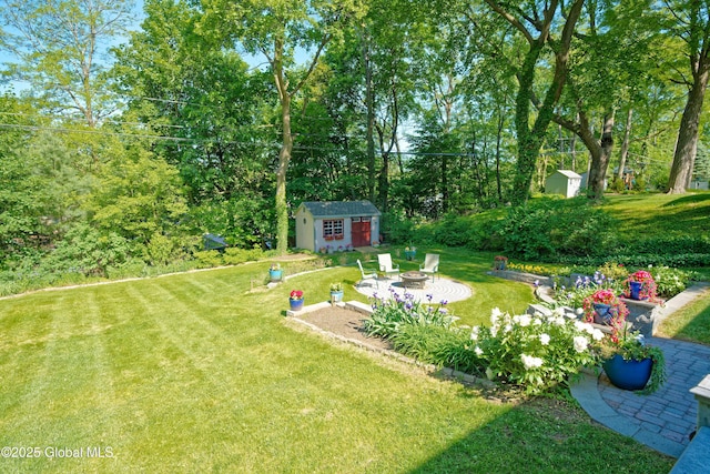 9 S Maple Ln, Colonie, NY 12211 - view of grassy yard featuring an outdoor fire pit and a patio