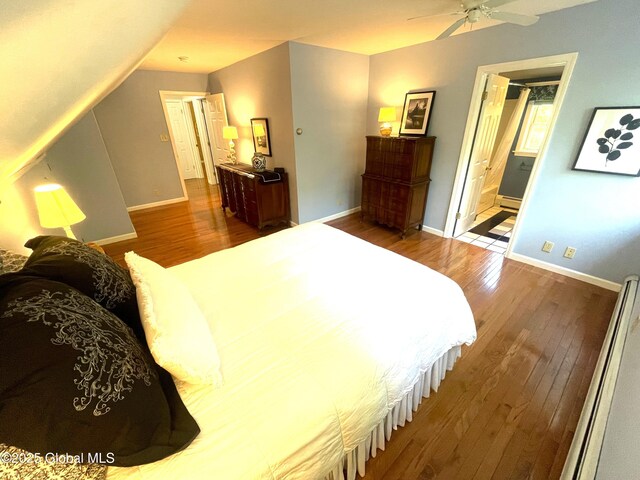 9 S Maple Ln, Colonie, NY 12211 - bedroom featuring wood finished floors, baseboards, and ensuite bath