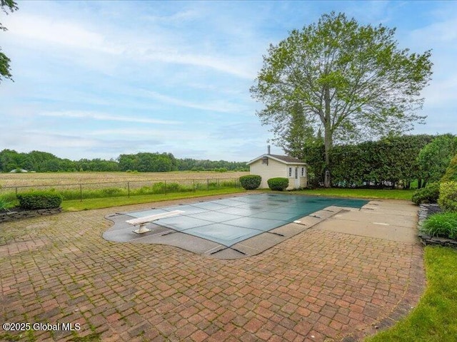 3077 New Williamsburg Dr, Guilderland, NY 12303 - view of swimming pool featuring a patio area, a diving board, and an outdoor structure