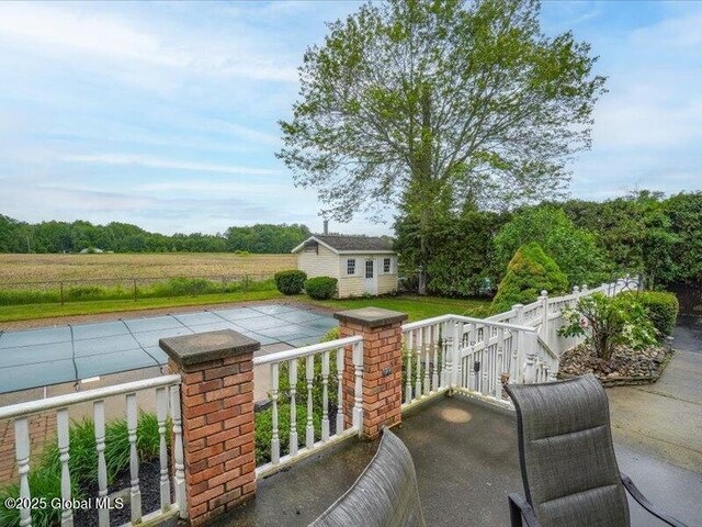 3077 New Williamsburg Dr, Guilderland, NY 12303 - view of patio / terrace featuring a storage unit