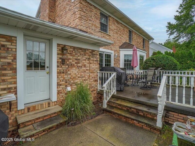 3077 New Williamsburg Dr, Guilderland, NY 12303 - entrance to property featuring brick siding and a chimney