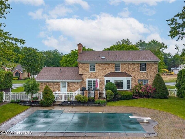 3077 New Williamsburg Dr, Guilderland, NY 12303 - back of property with a chimney, a gate, a covered pool, and a patio