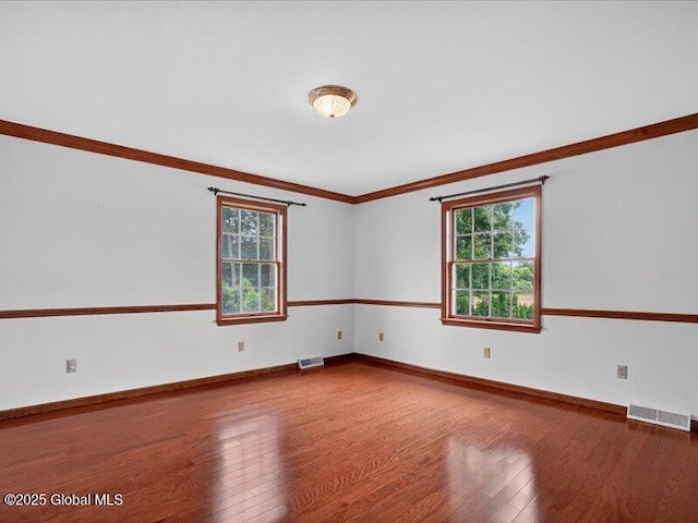 3077 New Williamsburg Dr, Guilderland, NY 12303 - empty room featuring wood finished floors and ornamental molding