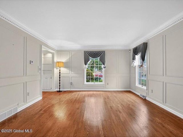 3077 New Williamsburg Dr, Guilderland, NY 12303 - empty room with a decorative wall, wood finished floors, and ornamental molding
