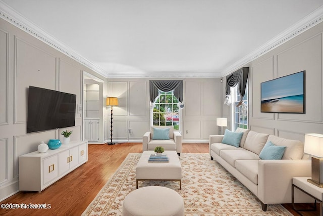 3077 New Williamsburg Dr, Guilderland, NY 12303 - living area with a decorative wall, light wood finished floors, and crown molding