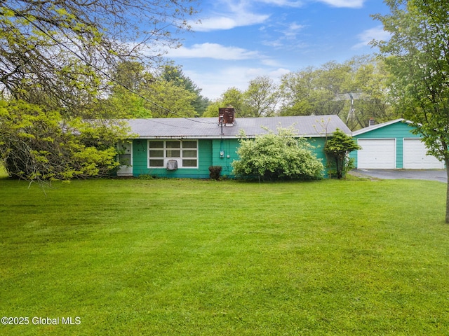 195 N St, Cobleskill, NY 12043 - ranch-style house with a detached garage, a front lawn, a chimney, and an outdoor structure