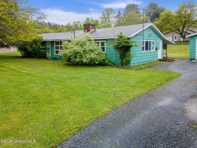 195 N St, Cobleskill, NY 12043 - rear view of property featuring a yard and a chimney