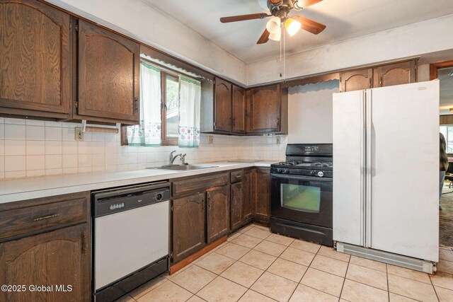 195 N St, Cobleskill, NY 12043 - kitchen with white appliances, a sink, light countertops, light tile patterned flooring, and decorative backsplash