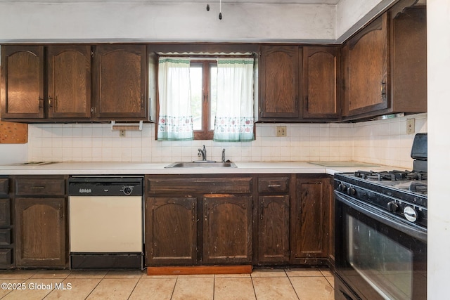 195 N St, Cobleskill, NY 12043 - kitchen with black range with gas stovetop, dishwasher, a sink, light tile patterned floors, and light countertops