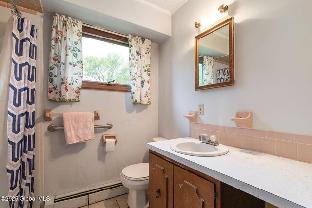 195 N St, Cobleskill, NY 12043 - bathroom with a baseboard radiator, vanity, toilet, crown molding, and a shower with shower curtain