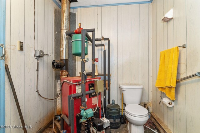195 N St, Cobleskill, NY 12043 - bathroom with toilet, wood walls, and a heating unit