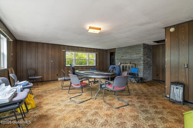 195 N St, Cobleskill, NY 12043 - carpeted dining room featuring wood walls and a fireplace