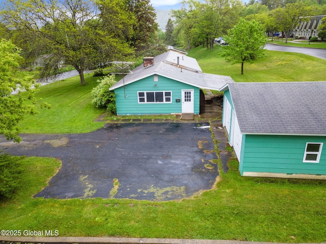 195 N St, Cobleskill, NY 12043 - view of front of home featuring a front lawn and a shingled roof
