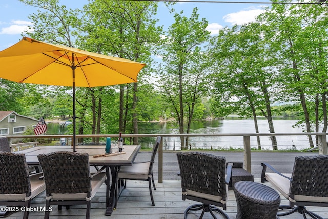 858 E River Dr, Lake Luzerne, NY 12846 - wooden terrace featuring a water view, outdoor dining space, and view of wooded area