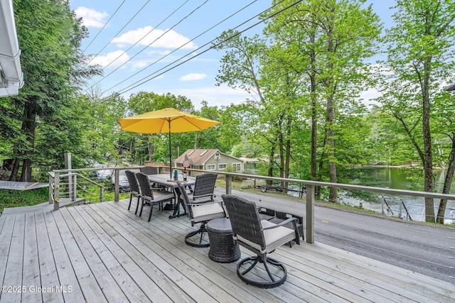 858 E River Dr, Lake Luzerne, NY 12846 - deck featuring outdoor dining area and view of wooded area