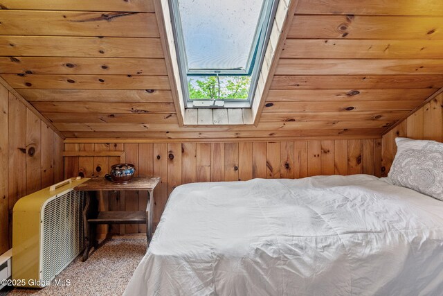858 E River Dr, Lake Luzerne, NY 12846 - bedroom with vaulted ceiling, wood walls, a skylight, and carpet