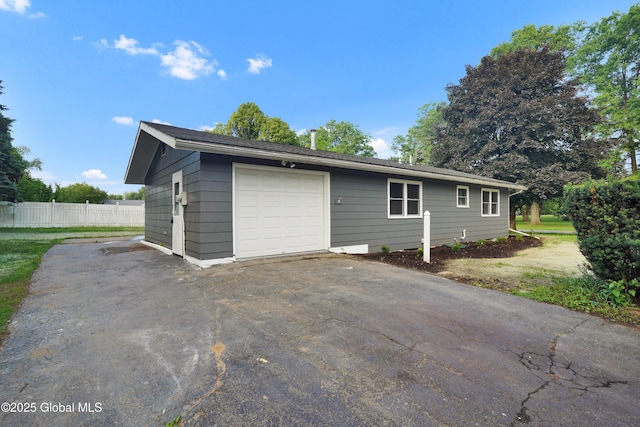 106 E Berkley Sq, Glenville, NY 12302 - view of home's exterior featuring asphalt driveway and a garage