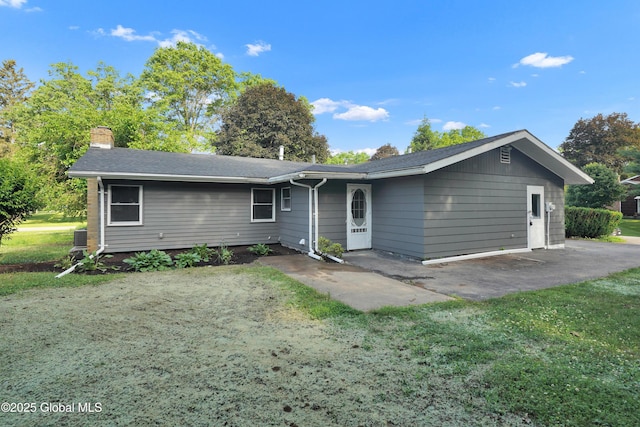 106 E Berkley Sq, Glenville, NY 12302 - view of front of house with a chimney, a front yard, and a patio area