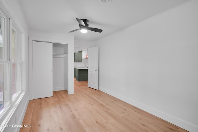 106 E Berkley Sq, Glenville, NY 12302 - unfurnished bedroom featuring a closet, light wood finished floors, and a ceiling fan
