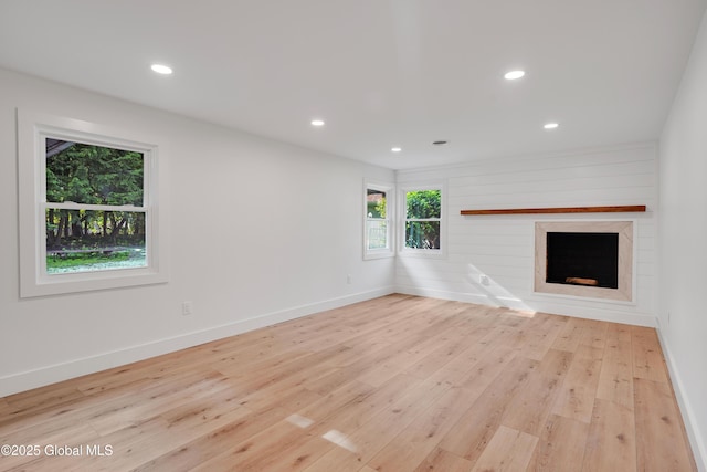 106 E Berkley Sq, Glenville, NY 12302 - unfurnished living room with wood finished floors, recessed lighting, and a large fireplace