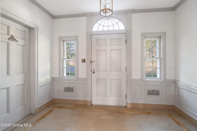 2125 Rosendale Rd, Niskayuna, NY 12309 - entrance foyer with wainscoting, crown molding, and inlaid floor details