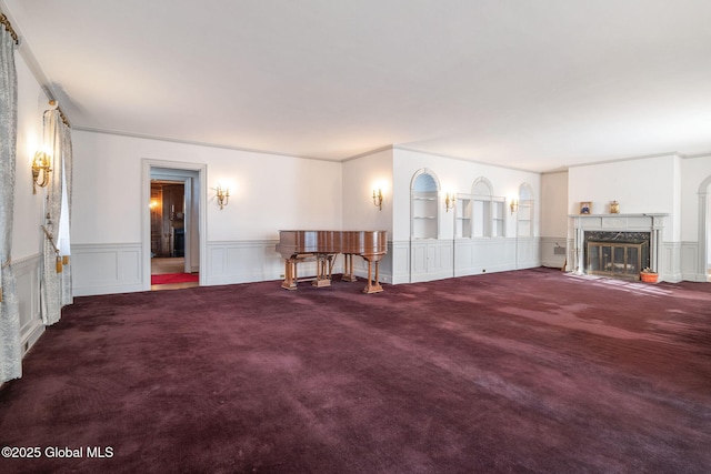 2125 Rosendale Rd, Niskayuna, NY 12309 - carpeted living room featuring a decorative wall, wainscoting, and a high end fireplace