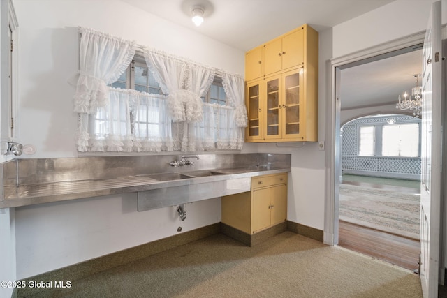 2125 Rosendale Rd, Niskayuna, NY 12309 - kitchen featuring stainless steel counters, carpet flooring, a chandelier, cream cabinetry, and baseboards