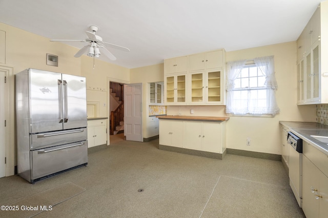 2125 Rosendale Rd, Niskayuna, NY 12309 - kitchen with freestanding refrigerator, a ceiling fan, dishwasher, glass insert cabinets, and baseboards