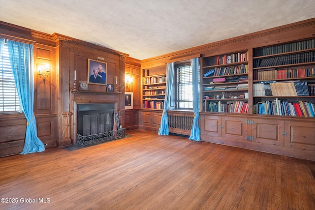 2125 Rosendale Rd, Niskayuna, NY 12309 - sitting room with a fireplace with flush hearth, wooden walls, wood finished floors, and built in features