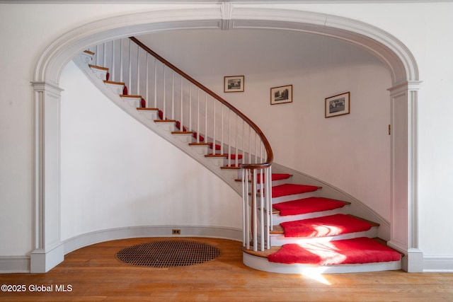 2125 Rosendale Rd, Niskayuna, NY 12309 - stairway with wood finished floors, arched walkways, and ornate columns