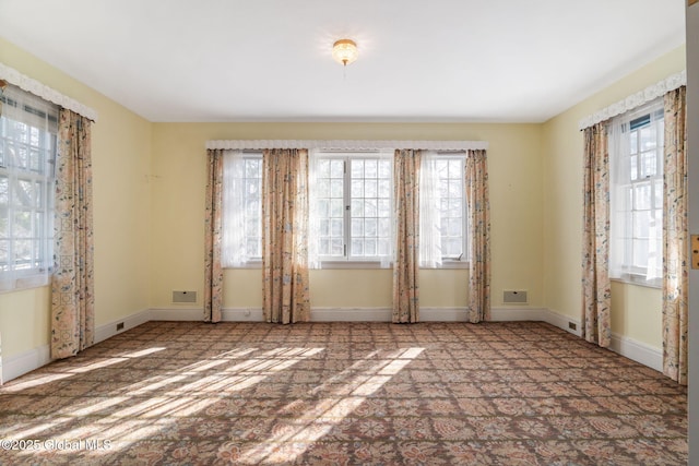 2125 Rosendale Rd, Niskayuna, NY 12309 - empty room featuring plenty of natural light, carpet floors, and baseboards